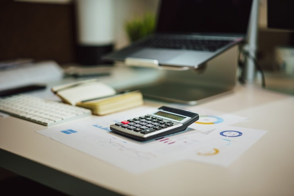 Financial calculator and charts on desktop, showing the white-label accounting service ContaFlow offers to accountancy firms